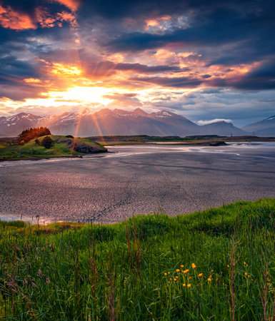 Dried estuary on the Stokksnes headland, southeastern Icelandic coast with Vestrahorn mountain range on background. Great sunrise in Iceland, Europe. Beauty of nature concept background.の写真素材