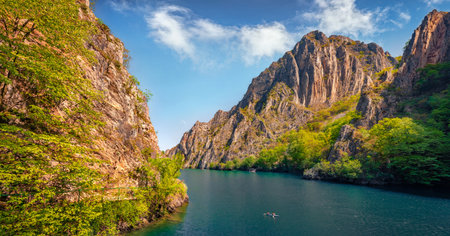 Adorable summer view of Matka Canyon with tourists on kayak. Gorgeous morning scene of North Macedonia, Europe. Travel concept background.の写真素材