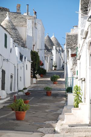 A street of traditional trulli house in Alberobello in Puglia, southern Italyの写真素材