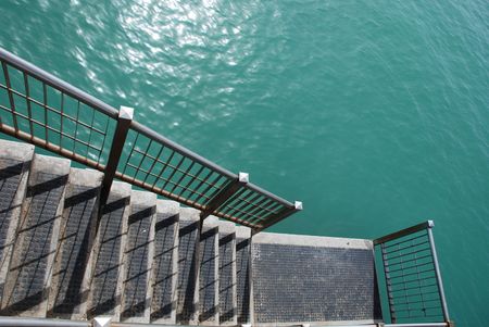 The pier at the southern Italian resort of Frankaville Delle Mare in Abruzzo. This shot shows steps from the pier leading down towards the water の写真素材