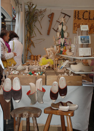 Udine, Italy, 09.21.08: A stall selling wooden craft items in Udine, part of the annual Friuli Doc festival which celebrates the food, drink and craft of the regionのeditorial素材