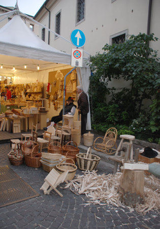 Udine, Italy, 09.21.08: A stall selling wooden craft items in Udine, part of the annual Friuli Doc festival which celebrates the food, drink and craft of the regionのeditorial素材