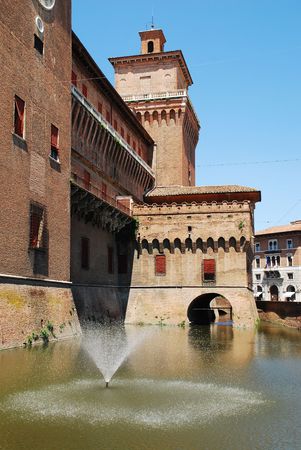 The medieval Castle Estense (Castello Estense) in Ferrara, Emiglia-Romagna, Italy. It is surronded by a moat and has 3 draw-bridge entrancesの写真素材