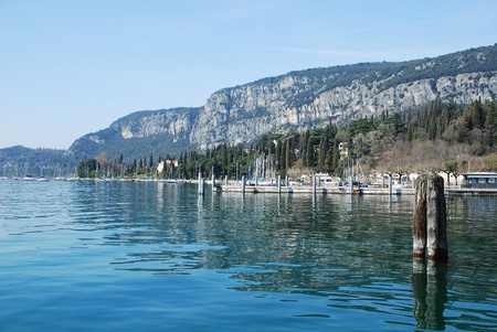 A view over Lake Garda in Veneto, Italy, taken from the shore at the town of Gardaの写真素材