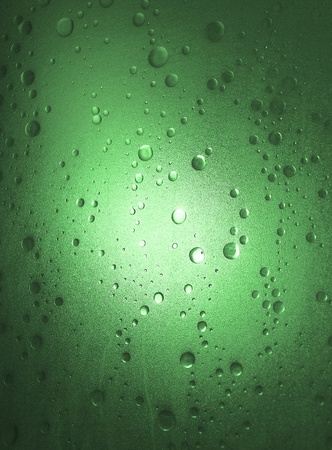 Light shines through a plastic shower door with a bubble-effect surfaceの写真素材