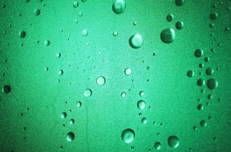 Light shines through a plastic shower door with a bubble-effect surfaceの写真素材