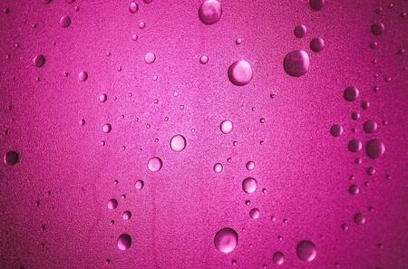 Light shines through a plastic shower door with a bubble-effect surfaceの写真素材