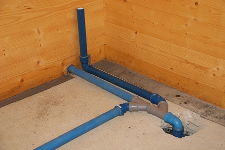 A bathroom sink connection in a partially constructed house showing a 45 degree angle splitter and a 90 degree bend for ingoing waterの写真素材
