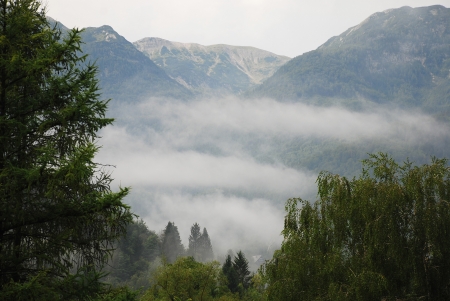 Early morning clouds after a thunderstorm in the Stara Fuzina valley near the shore of Lake Bohinj in the Upper Carniola region of Slovenia  It is part of the Triglav National Park and is located in a valley of the Julian Alps の写真素材