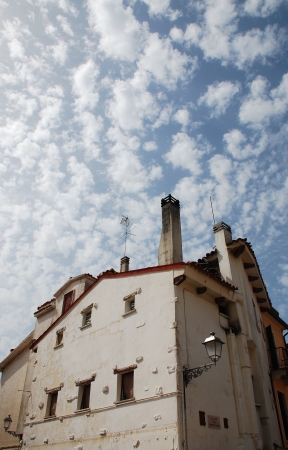 An historic building in the seaside town of Caorle in the Veneto region of Italyの写真素材