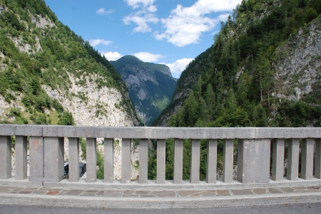 Mountains in the Friulian Dolomites in north east Italy  A road concrete barrier can be seen in the foreground の写真素材