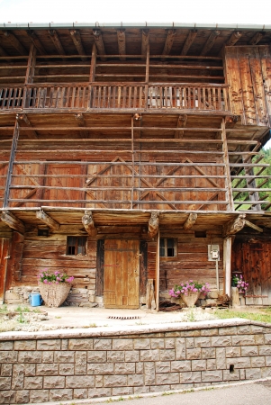 An old wooden agricultural building in a north eastern Italian villageの写真素材