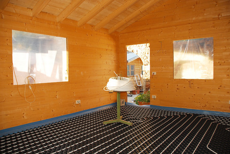 A hydronic closed loop underfloor heating system laid out on molded insulated panelの写真素材