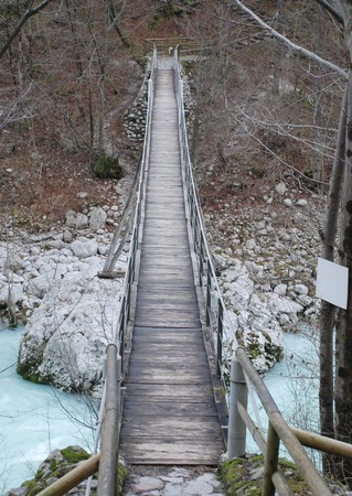 A wood and rope suspension bridge in Slovenia over the Soca River  known as the Isonzo in neighbouring Italy の写真素材