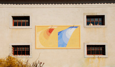 One of the many sundials on the exterior of the Friulian Farming Culture Museum  Museo della Civilta Contadina del Friuli Imperiale  in Aiello del Friuli, Italy  This one from 1998 is known as the Meridiana ad Ore del Tramonto or Dawn Time Sundialのeditorial素材