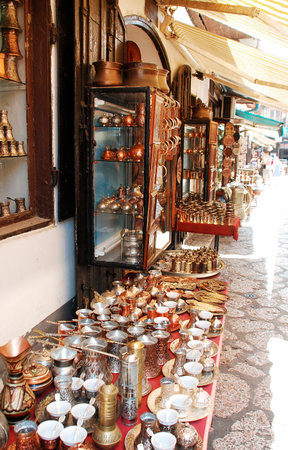 Sarajevo, Bosnia and Herzegovina - August 10th 2014. Metal goods for sale outside a tourist souvenir shop in a street in Bascarsija, Sarajevoのeditorial素材