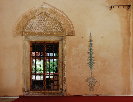 A door on the exterior of Karadjozbey Mosque in Mostarの写真素材
