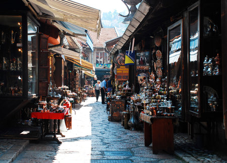 Sarajevo, Bosnia and Herzegovina - August 10th 2014. Metal goods for sale outside a tourist souvenir shop in a street in Bascarsija, Sarajevoのeditorial素材