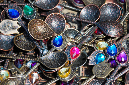 Sarajevo, Bosnia and Herzegovina - August 10th 2014. Jewelled coffee spoons for sale outside a tourist souvenir shop in a street in the old townのeditorial素材