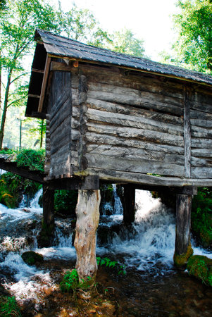 A group of disused mini wooden watermills (known as Mlincici) located on Pliva Lake (Plivska Jezera) near Jajce in the in the Bosanska Krajina region of Bosnia and Herzegovina.のeditorial素材