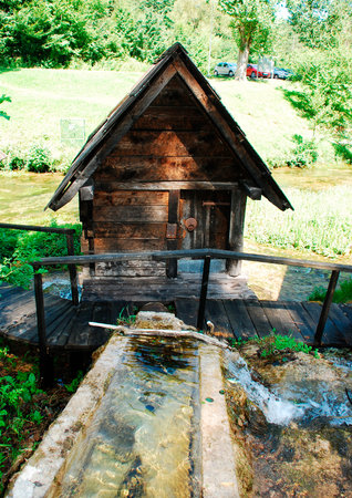 A group of disused mini wooden watermills (known as Mlincici) located on Pliva Lake (Plivska Jezera) near Jajce in the in the Bosanska Krajina region of Bosnia and Herzegovina.のeditorial素材