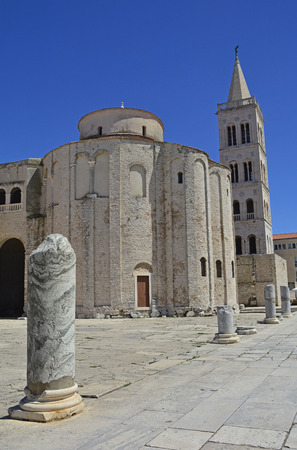 St Donatus Church, the largest pre-Romanesque building in Croatia, was constructed in the 9th and 10th centuries. Part of the Roman Forum can be seen in the foreground, and the spire of 12th/13th century Romanesque St Anastasia's Cathedral can be seen behの写真素材