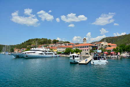 Skadin, Croatia - July 2nd 2016. Boats heading towards Krka National Park await tourists at the start of the tourist season in the small town of Skradin on the coast of the Sibenik-Knin County of Croatia.のeditorial素材