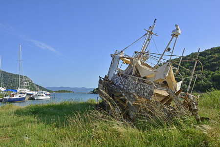 An old derelict beached boat outside the Croatian village of Blace.の写真素材