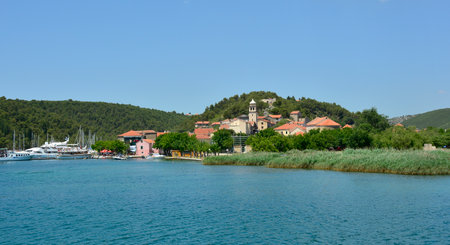 Skadin, Croatia - July 2nd 2016. Boats heading towards Krka National Park await tourists at the start of the tourist season in the small town of Skradin on the coast of the Sibenik-Knin County of Croatia.のeditorial素材