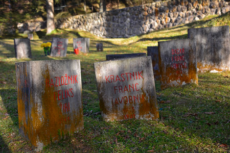 Begunje, Slovenia - December 25th 2016. Gravestones at the Begunje Hostages Cemetery. The small cemetry is a World War Two memorial.のeditorial素材