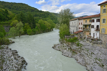 The waterfront houses in the small western Slovenian town of Kanal. The Soca river was unusally full at the time the photograph was taken.の写真素材