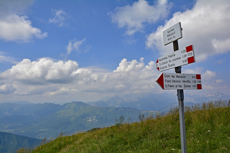 A signpost on the peak of the Matajur mountain in Friuli Venezia Giulia, north east Italyの写真素材