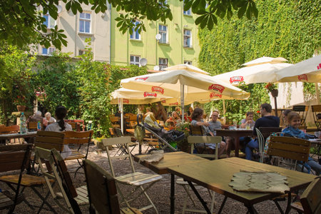 Krakow, Poland - July 13th 2018. Customers enjoy drinks at a popular outdoor bar in the Kazimierz district of Krakowのeditorial素材