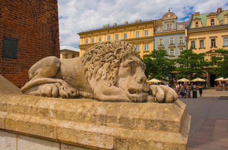 Krakow, Poland - July 8th 2018. One of the stone lions outside the Town Hall Tower in the historic Rynek Glowny square in old town Krakowのeditorial素材