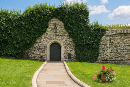 An old stone wall and gate in the historic Wawel Castle in Krakow, Polandのeditorial素材