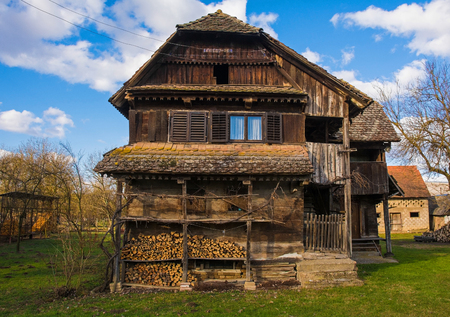 A traditional wooden building in the small village of Muzilovcica in Sisak-Moslavina County in central Croatiaの写真素材