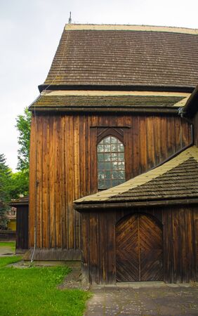 The historic St Bartholomew's Parish Church in Nowa Huta, Krakow. This wooden gothic church has a three nave body and dates from 1466の写真素材