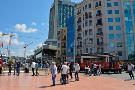 Istanbul, Turkey - September 8th 2019. Tourists wait to board the famous Nostalgic Tram in Taksim Square which runs from Taksim Square to Tunel along Istiklal Cadessi in Beyoglu.のeditorial素材