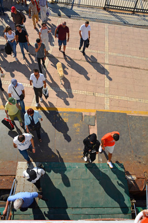 Burgazada, Turkey - September 18th 2019. Tourists board the ferry to Moda in Kadikoy, Istanbul at...