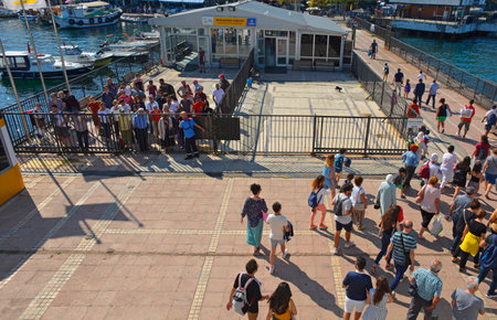 Burgazada, Turkey - September 18th 2019. Tourists disembark the ferry from Buyukada to Moda in...
