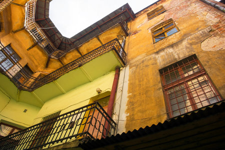 An old hisitoric building in a state if disrepair in an alleyway in Krakow, Polandのeditorial素材