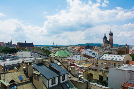A view over the roof tops of old town Krakow in Poland. St. Mary's Basilica can be seen in the background right and Wawel Cathedral in the background far leftのeditorial素材
