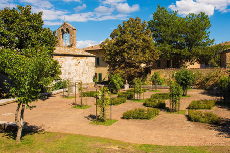 A public garden park in the historic medieval village of San Quirico D'Orcia, Siena Province,...