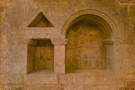 Chiusdino, Italy - 7th September 2020. A wall recess in the remains of the roofless San Galgano Abbey in Siena Province, Tuscany. The recess, a piscina or sacrarium, was used for washing communion vesselsのeditorial素材