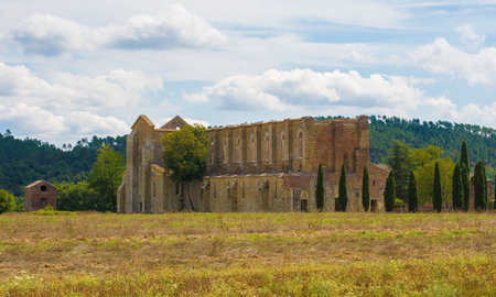 Chiusdino, Italy - 7th September 2020. The landscape surrounding the roofless San Galgano Abbey in Siena Province, Tuscany. The Gothic 13th-century Abbey was founded as a Cistercian Monasteryのeditorial素材