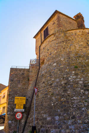 A former gateway, Porta Senese, in the medieval 13th century fortified city walls of the historic village of Batignano, Grosseto Province, Tuscany, Italyの写真素材