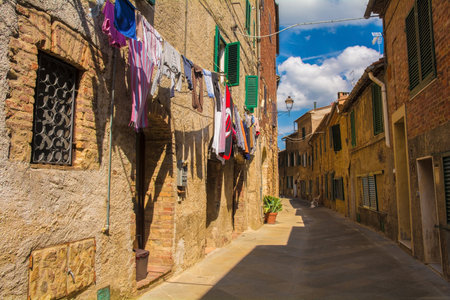 A quiet residential street in the historic centre of the medieval town of Monticiano in Siena Province, Tuscany, Italyのeditorial素材
