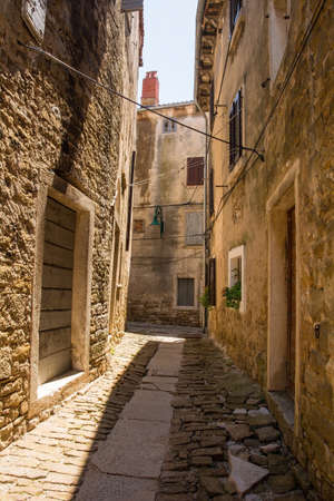 A residential road in the historic medieval hill village of Buje in Istria, Croatiaの写真素材