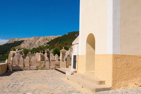 Baska, Croatia - 4th September 2021. The entrance to St John the Baptist Church, on a hill overlooking Baska town on Krk island, Primorje-Gorski Kotar County. Also called Crkva Svetog Ivanaのeditorial素材