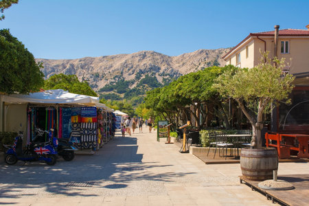 Baska, Croatia - 4th September 2021. A street in late summer in historic coastal town of Baska on Krk island in the Primorje-Gorski Kotar County of western Croatiaのeditorial素材